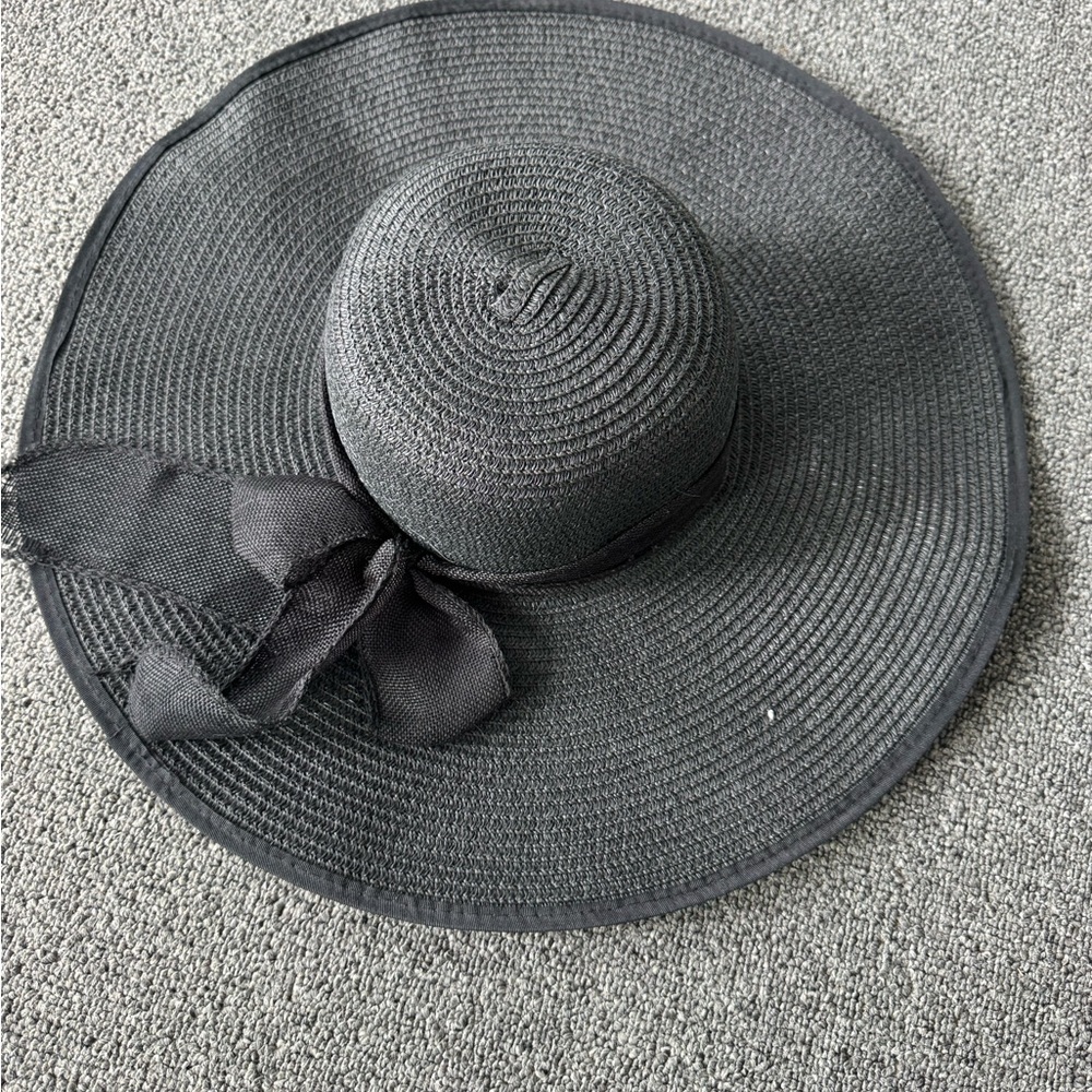 stylish black straw sun hat with a floppy wide brim
